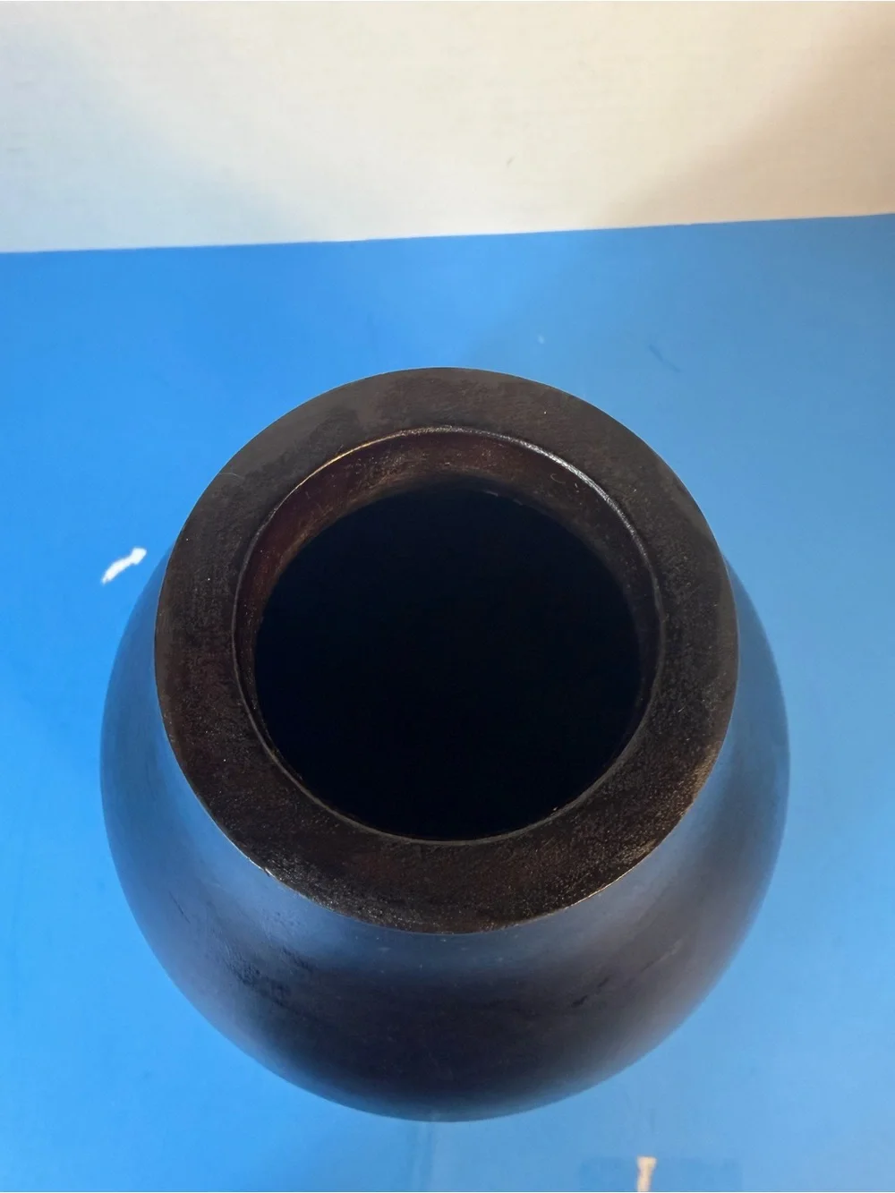hand-carved wooden vase with contrasting texture